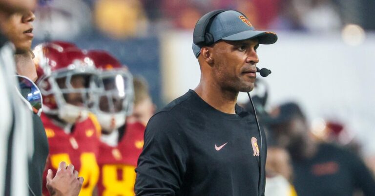 USC defensive coordinator D'Anton Lynn signs