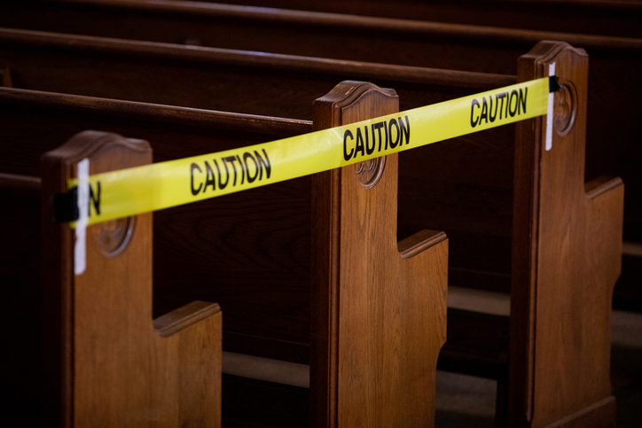 Church pews blocked off with caution tape