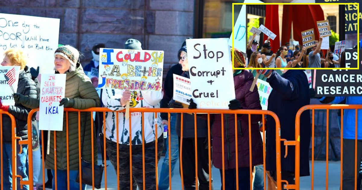 Trump confronted by protester before sign ripped away and he's